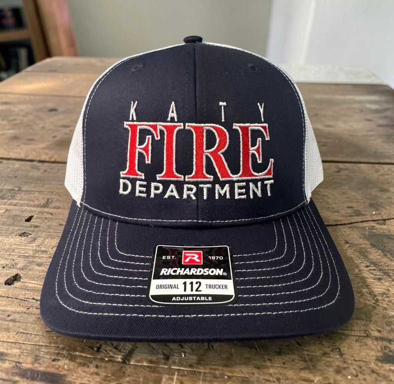 Fire Department trucker hat with navy front and white mesh, embroidered Fire Department logo.