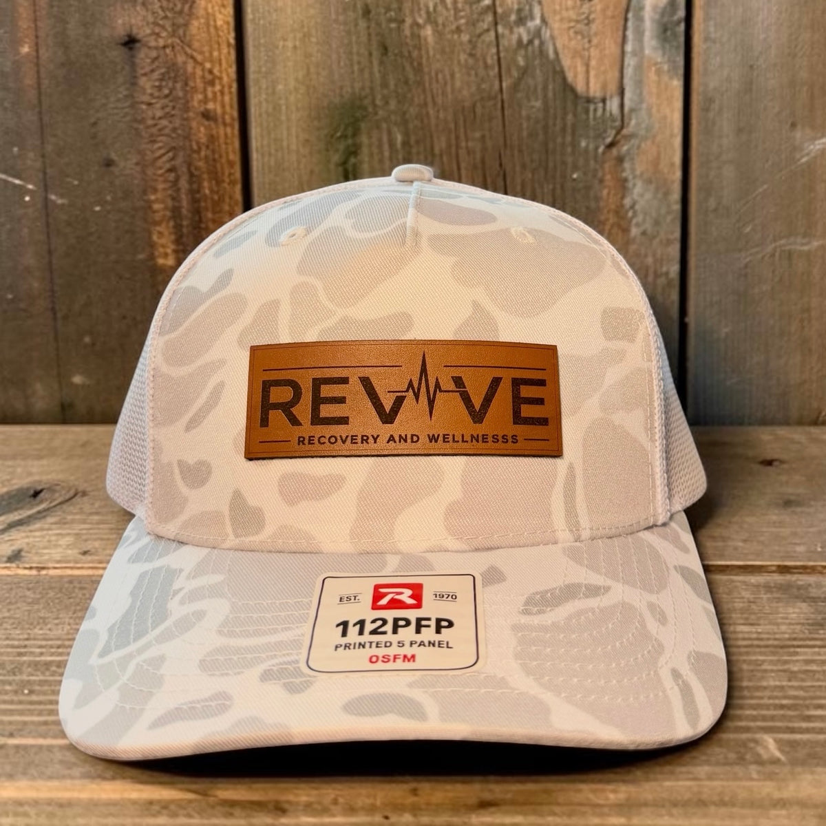 Custom Leather Patch Hat on Camo by Anchor Point Threads