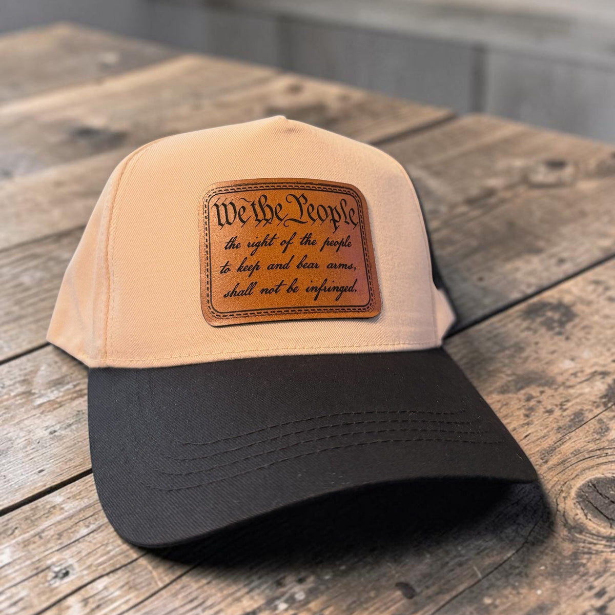 We the People laser-engraved leather patch hat on a two-tone Richardson 323